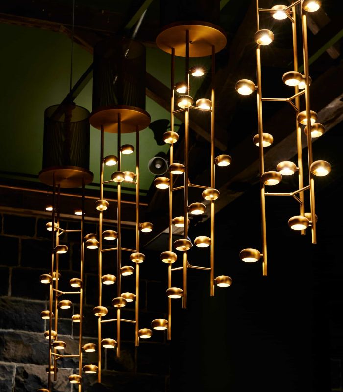 Launch_ItinerantSpirits_Bar_Lights_Detail__FocusFillWzcwMCw4MDasInkiLDEyNV0